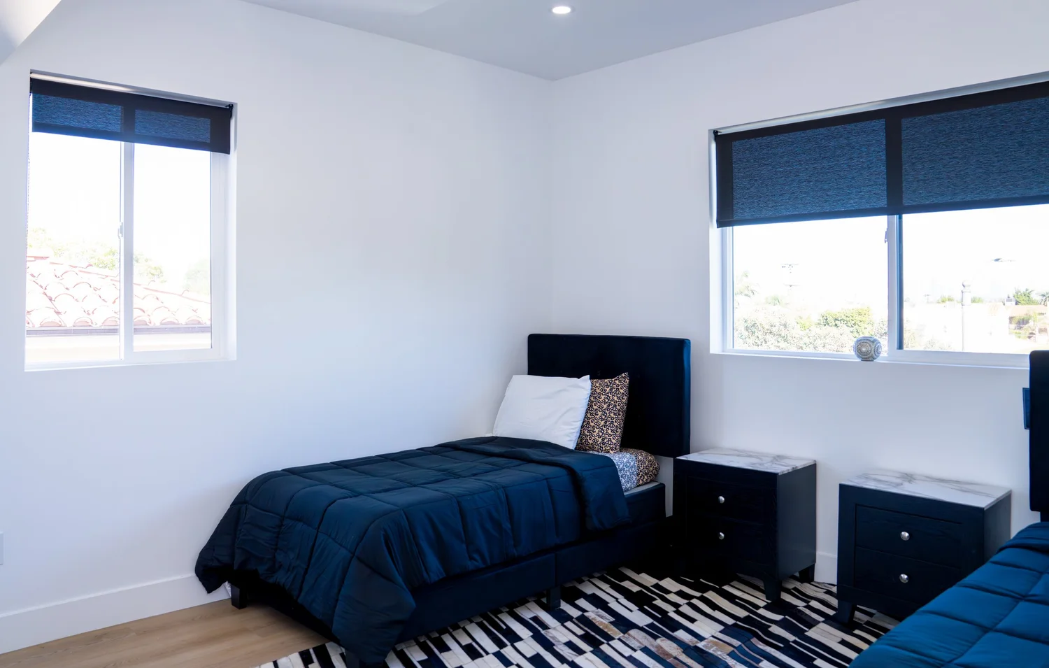 Calm private bedroom with patterned rug